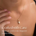 Gold Cross Urn Necklace (14K), worn